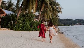 Tourists walking on the Beach in the Southern of Thailand